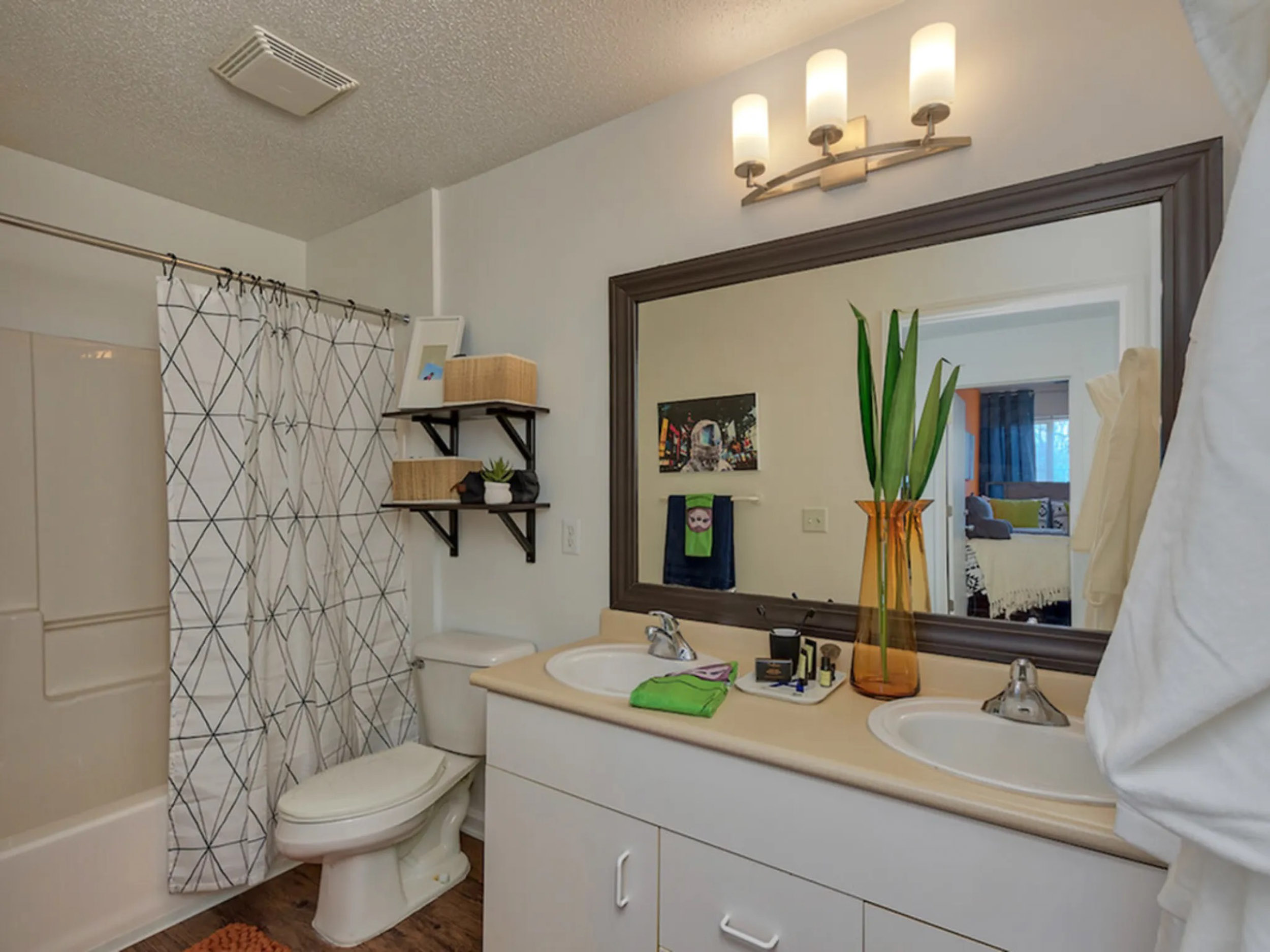 a bathroom with a mirror and sink