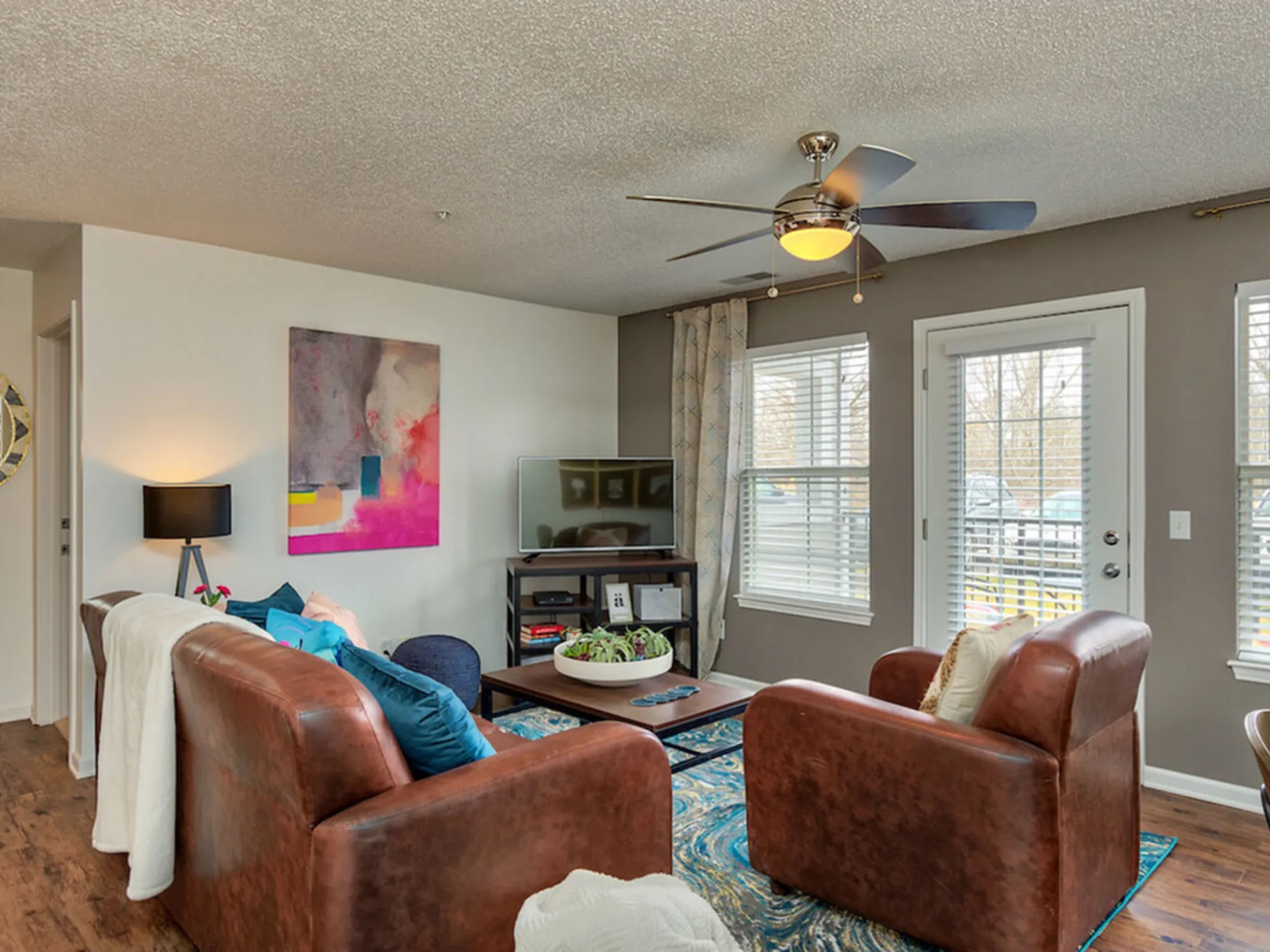 a living room with a couch and a tv