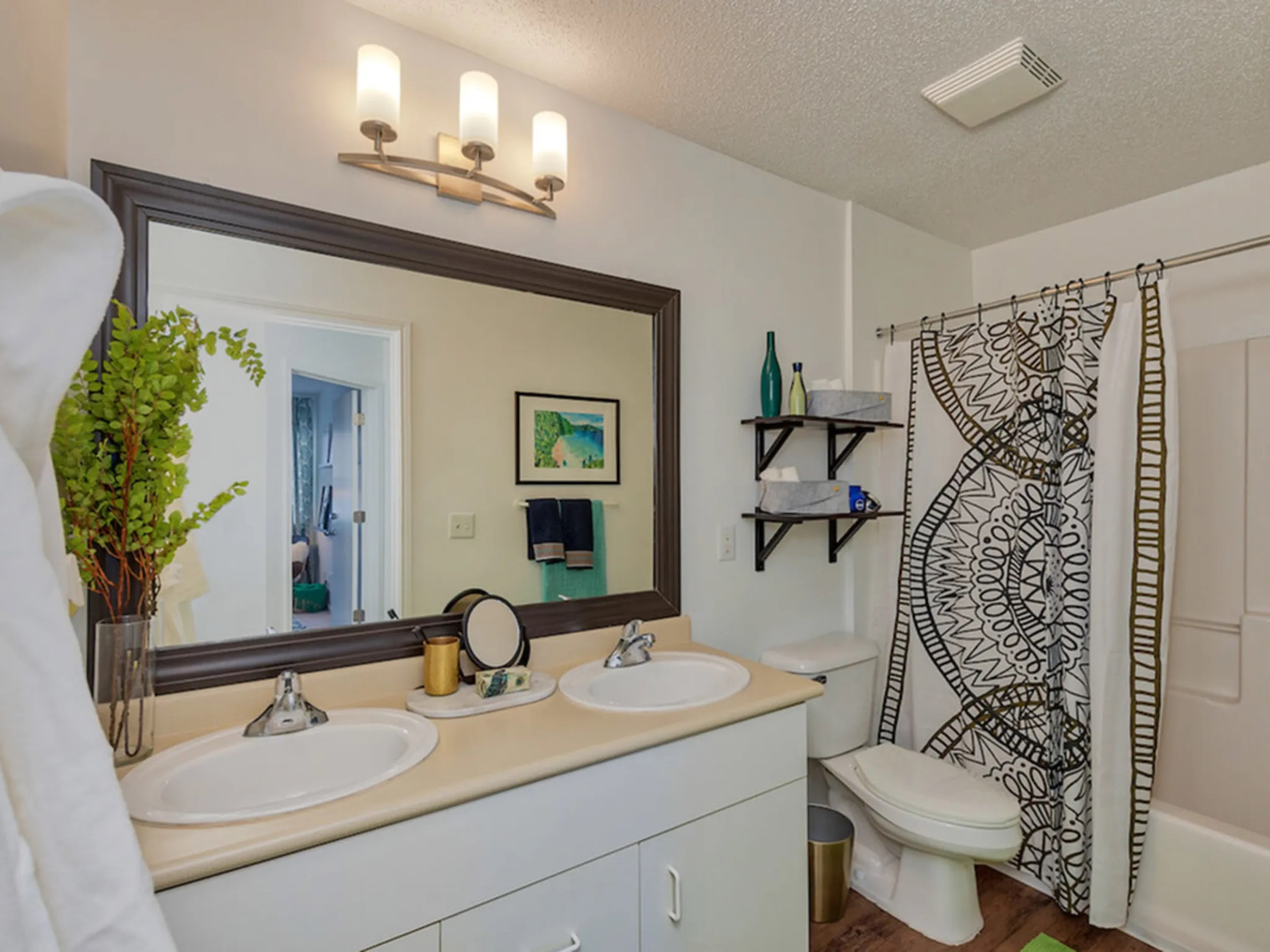 Bathroom with double sink vanity and large mirror