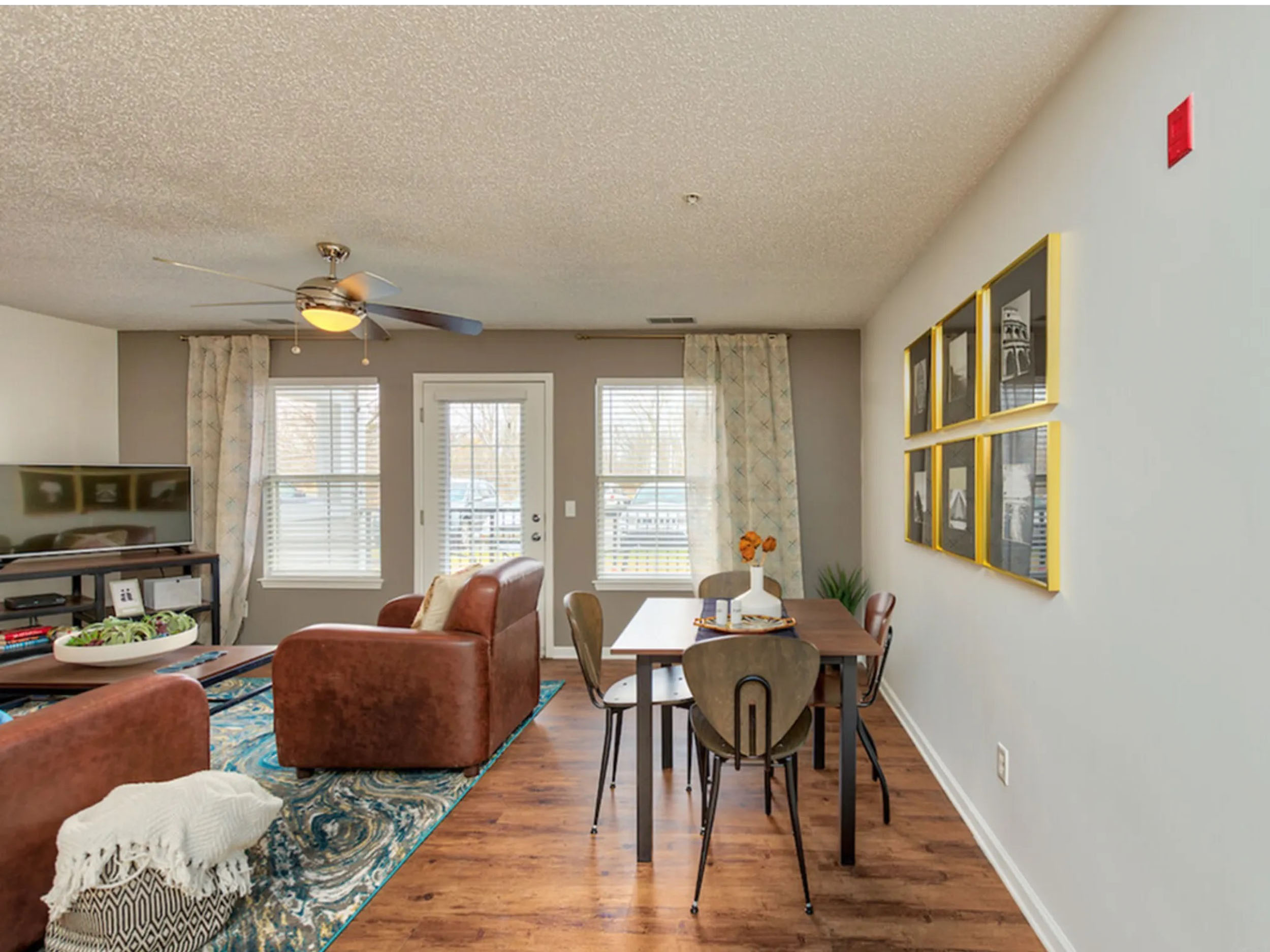 a living room with a table and chairs