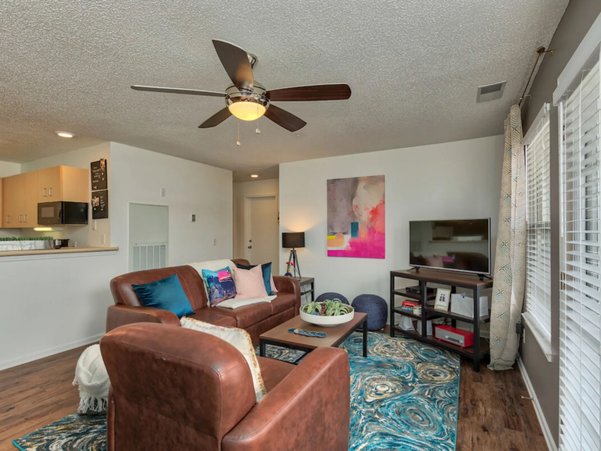 a living room with a couch and a tv